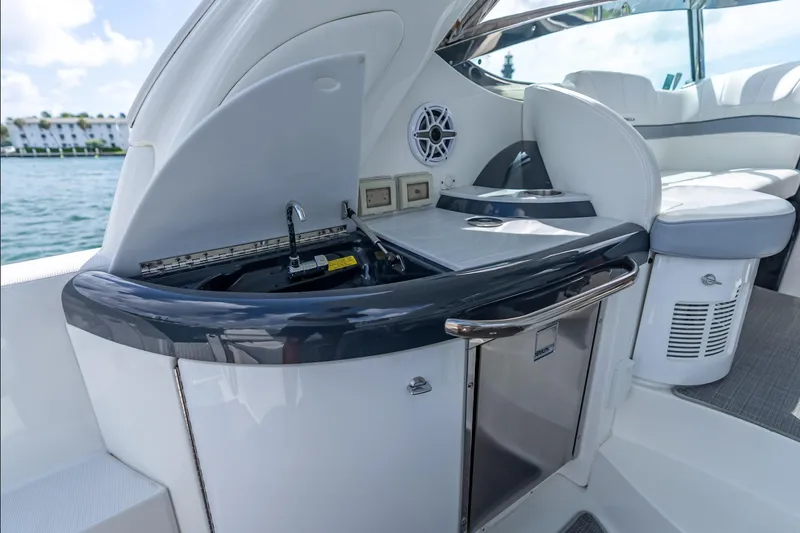 Slide: The Image of 2022 Formula 40 Performance Cruiser interior with kitchenette and seating area. - 19