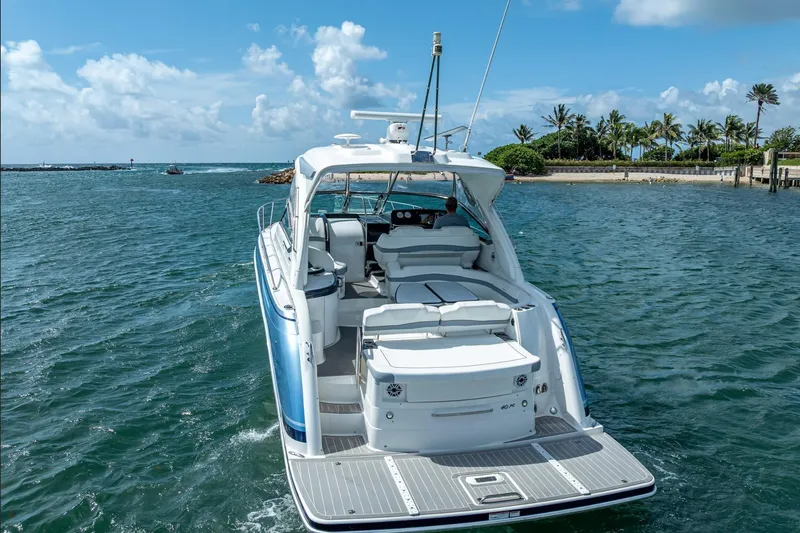 Slide: The Image of 2022 Formula 40 Performance Cruiser on scenic water with palm trees in background. - 3