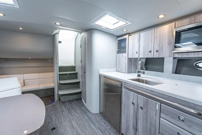 Slide: The Image of Luxurious interior of 2022 Formula 40 Performance Cruiser with modern kitchen and seating area. - 31