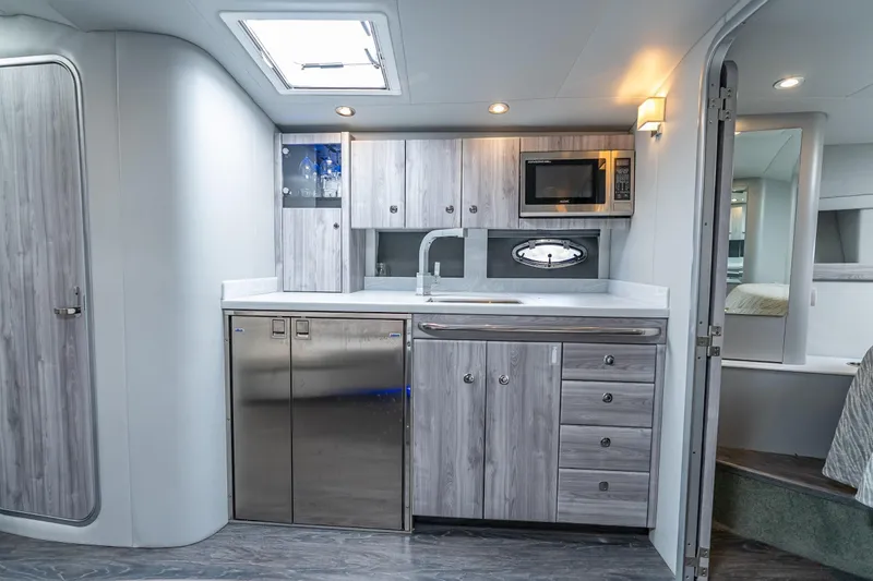 Slide: The Image of Modern kitchen in 2022 Formula 40 Performance Cruiser with sleek cabinetry and stainless steel appliances. - 33