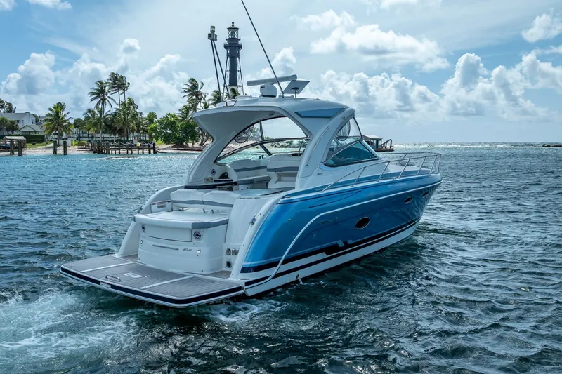 Slide: The Image of 2022 Formula 40 Performance Cruiser on tropical waters near a lighthouse and palm trees. - 5