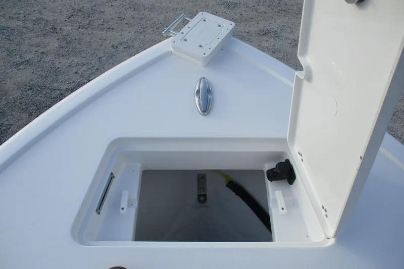 Slide: The Image of 2026 Sportsman Masters 267OE Bay Boat storage compartment with open hatch. - 14