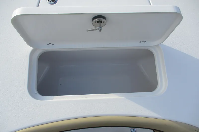 Slide: The Image of Open storage compartment on 2026 Sportsman Masters 267OE Bay Boat. - 15