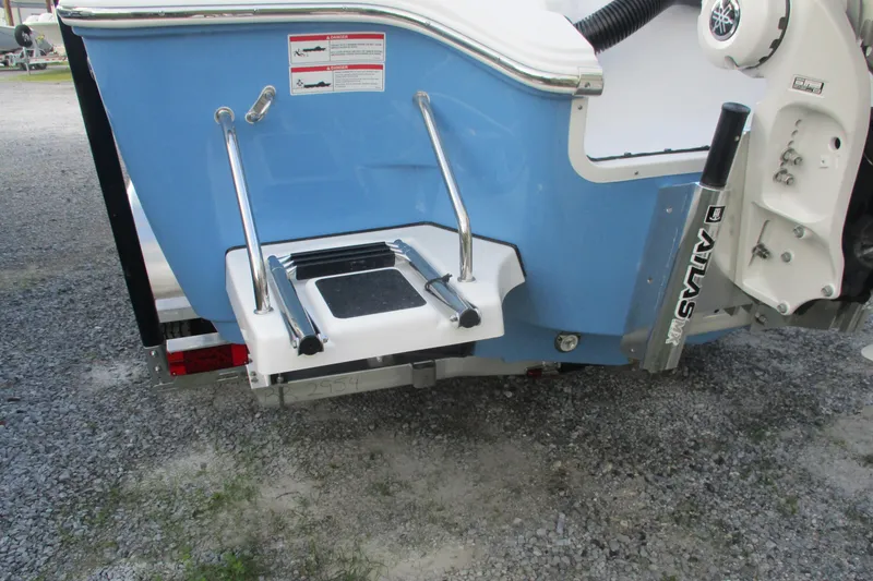 Slide: The Image of 2026 Sportsman Masters 267OE Bay Boat rear view with swim ladder and Atlas jack plate. - 20