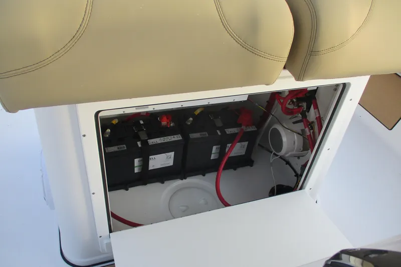 Slide: The Image of Battery compartment of 2026 Sportsman Masters 267OE Bay Boat with wiring and seating. - 21