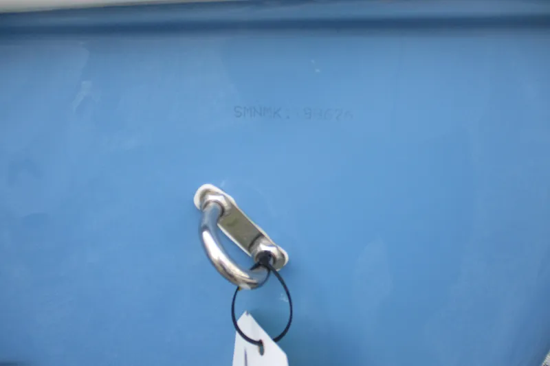 Slide: The Image of 2026 Sportsman Masters 267OE Bay Boat hull with metal cleat and identification number. - 23