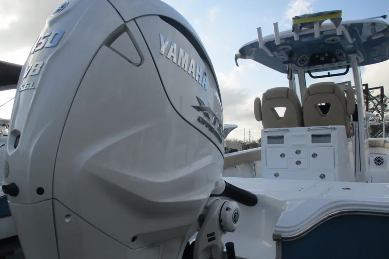 Slide: The Image of 2026 Sportsman Masters 267OE Bay Boat with Yamaha V8 engine, showcasing sleek design and seating. - 4