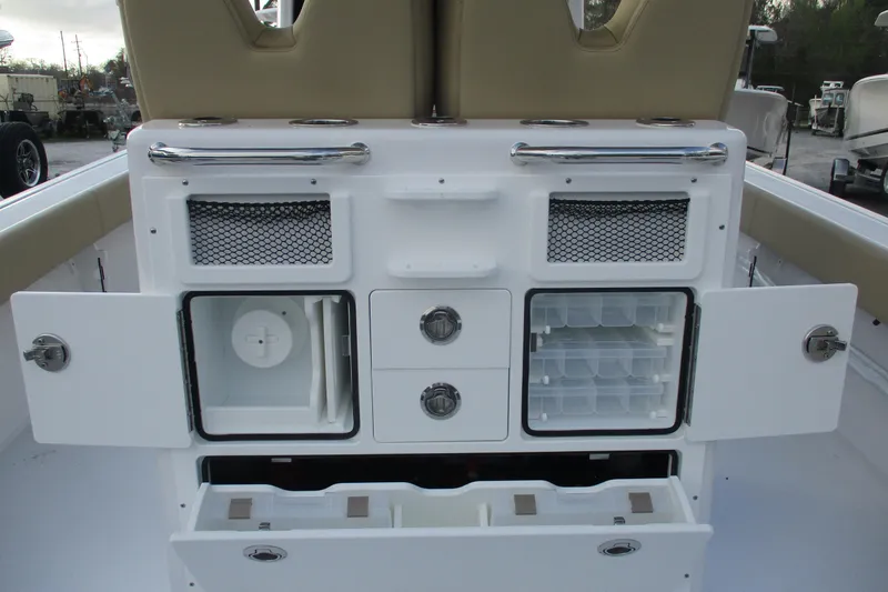 Slide: The Image of 2026 Sportsman Masters 267OE Bay Boat storage compartments and seating area. - 9