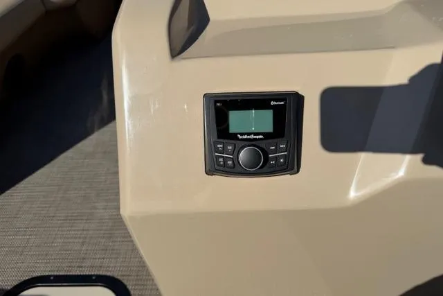 Slide: The Image of Control panel on 2022 Viaggio Lago 22U boat dashboard, featuring a Bluetooth-enabled audio system. - 12