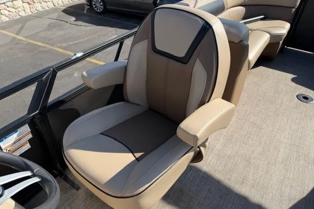 Slide: The Image of Luxurious seating on 2022 Viaggio Lago 22U pontoon boat, featuring beige and brown upholstery. - 13