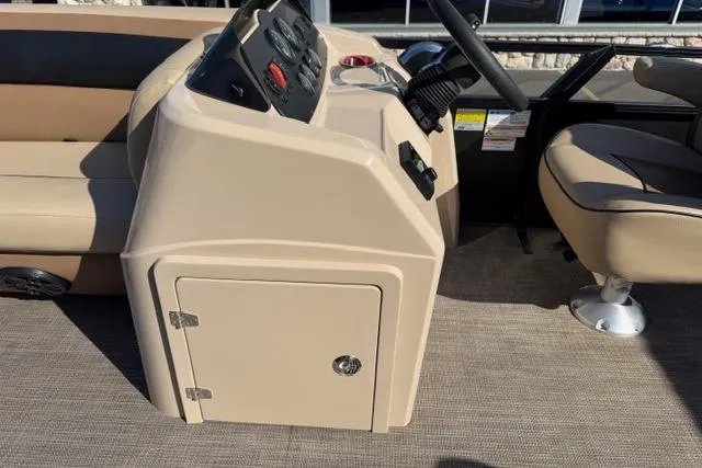 Slide: The Image of 2022 Viaggio Lago 22U boat console with beige seating and steering wheel. - 15