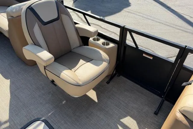 Slide: The Image of 2022 Viaggio Lago 22U boat interior with beige seating and cup holders. - 22