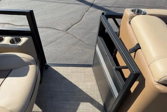 Slide: The Image of 2022 Viaggio Lago 22U boat interior with beige seating and cup holders. - 23