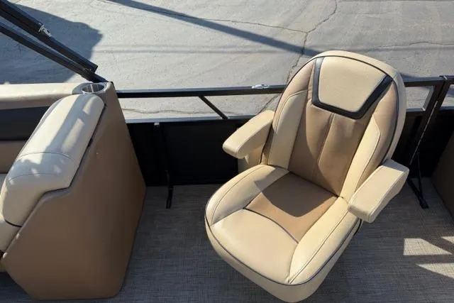Slide: The Image of Luxurious seating on 2022 Viaggio Lago 22U boat, featuring beige upholstery and armrests. - 24