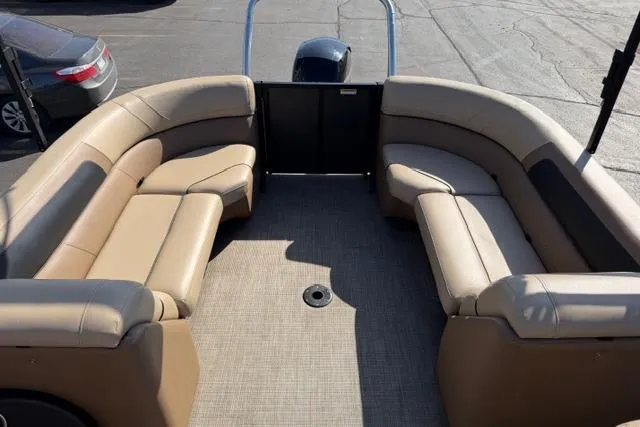 Slide: The Image of 2022 Viaggio Lago 22U pontoon boat with spacious beige seating and modern design. - 27