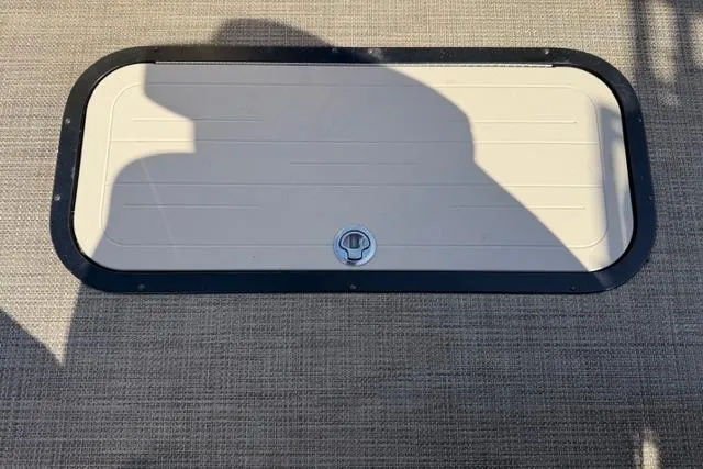 Slide: The Image of Hatch cover on 2022 Viaggio Lago 22U boat, beige with black trim. - 28