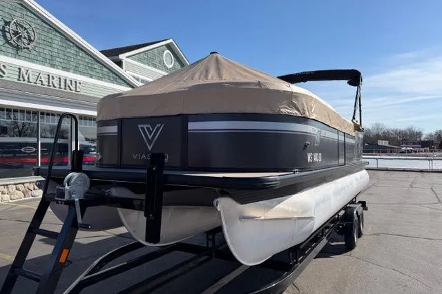 Slide: The Image of Viaggio Lago 22U pontoon boat, 2022 model, covered and on trailer at marina. - 30