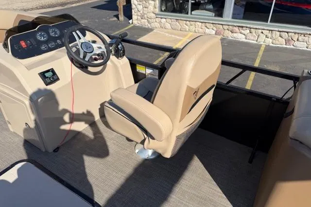 Slide: The Image of Viaggio Lago 22U 2022 boat interior with steering wheel and captain's chair. - 8