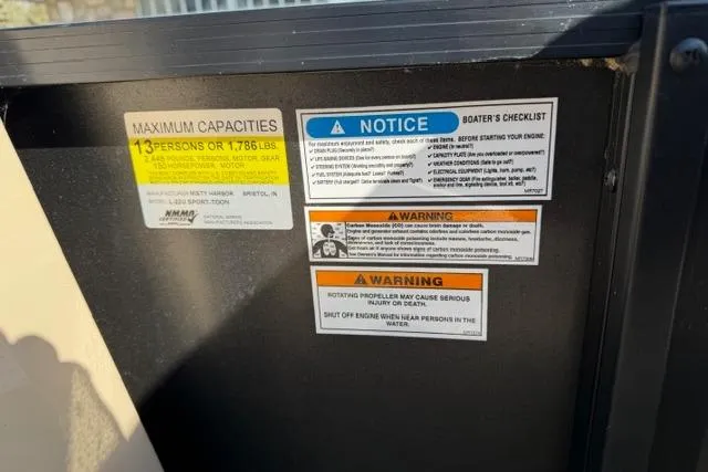 Slide: The Image of Viaggio Lago 22U 2022 boat capacity and safety warnings displayed on interior panel. - 9