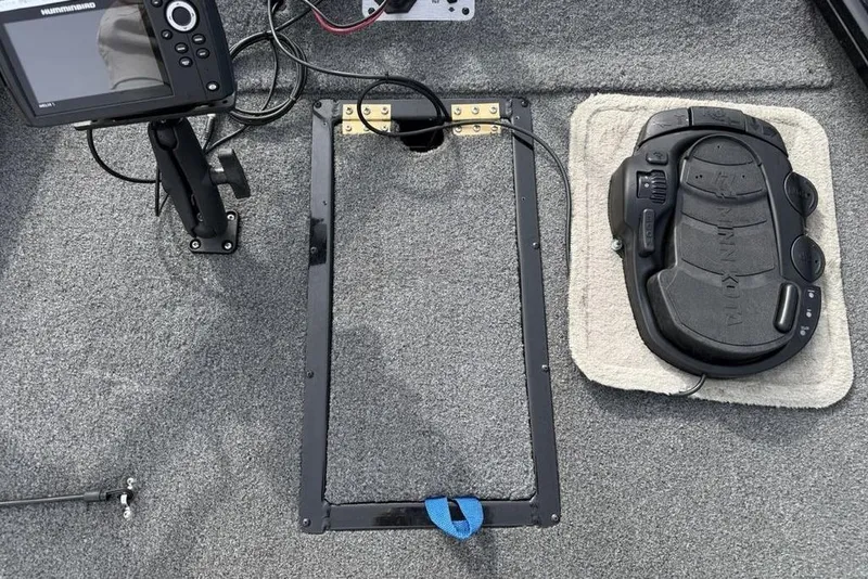 Slide: The Image of 2018 Tracker Pro Team 175 TXW boat deck with fishfinder and trolling motor pedal. - 13