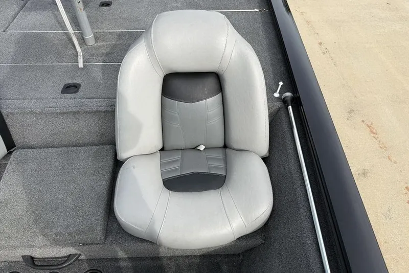 Slide: The Image of 2018 Tracker Pro Team 175 TXW boat seat, gray upholstery, on a carpeted deck. - 15