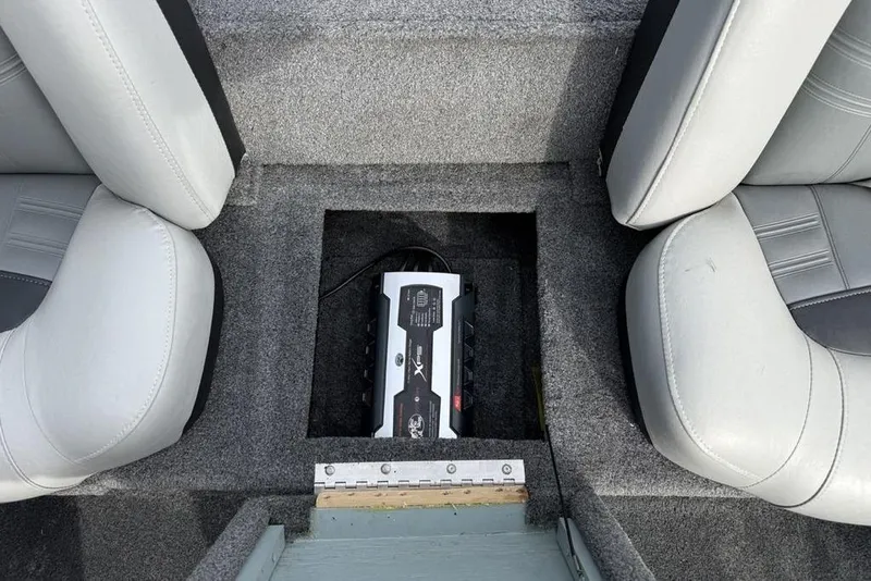 Slide: The Image of 2018 Tracker Pro Team 175 TXW boat interior with battery compartment between seats. - 17