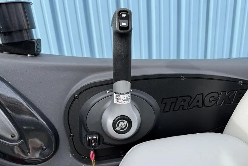 Slide: The Image of 2018 Tracker Pro Team 175 TXW boat throttle control with "UP" and "DN" buttons. - 19