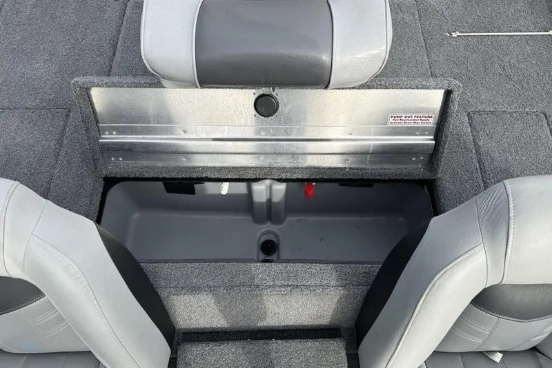 Slide: The Image of 2018 Tracker Pro Team 175 TXW boat interior storage compartment with gray seating. - 22