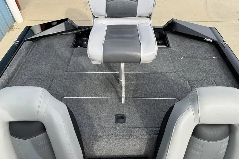 Slide: The Image of 2018 Tracker Pro Team 175 TXW boat interior with gray seating and carpeted deck. - 23