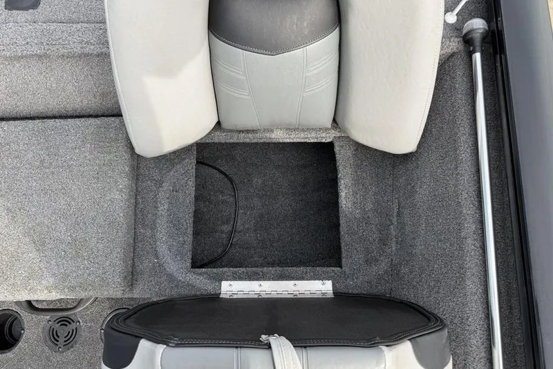 Slide: The Image of 2018 Tracker Pro Team 175 TXW boat seat storage compartment, gray upholstery. - 25