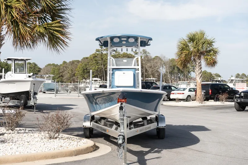 Slide: The Image of 2026 Sea Pro 230 Bay boat on trailer in sunny outdoor dealership setting. - 3