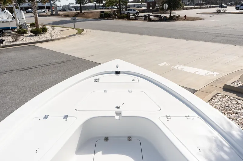 Slide: The Image of 2026 Sea Pro 230 Bay boat bow view in a marina setting. - 8