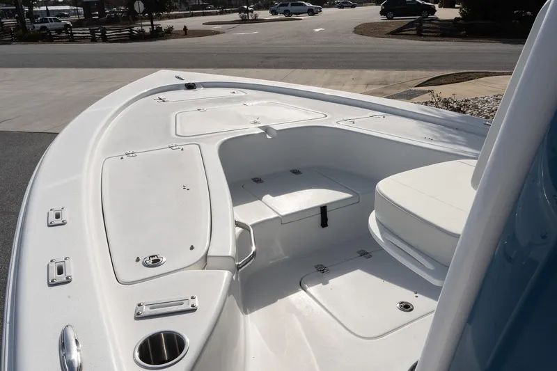 Slide: The Image of 2026 Sea Pro 230 Bay boat interior with spacious seating and storage compartments. - 9