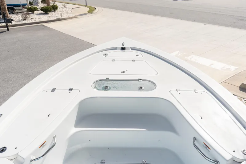 Slide: The Image of 2026 Sea Pro 250 Bay boat deck with storage compartments and clean design. - 14