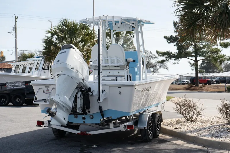 Slide: The Image of 2026 Sea Pro 250 Bay boat on trailer, featuring a powerful outboard motor. - 5