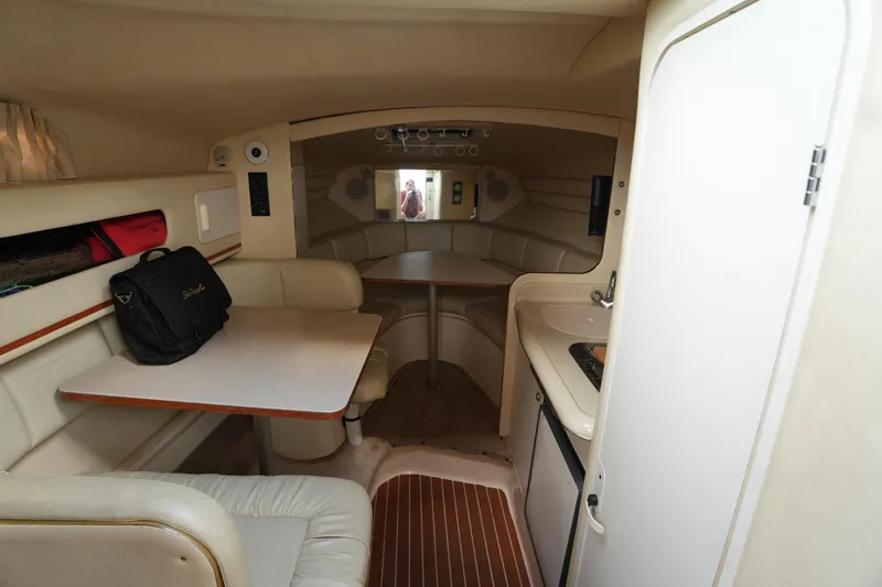 Slide: The Image of Interior of 2000 Sea Ray 270 Sundancer boat with seating and table. - 17