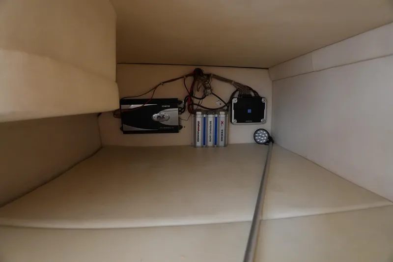 Slide: The Image of Interior view of 2000 Sea Ray 270 Sundancer boat showing electrical components and wiring. - 24