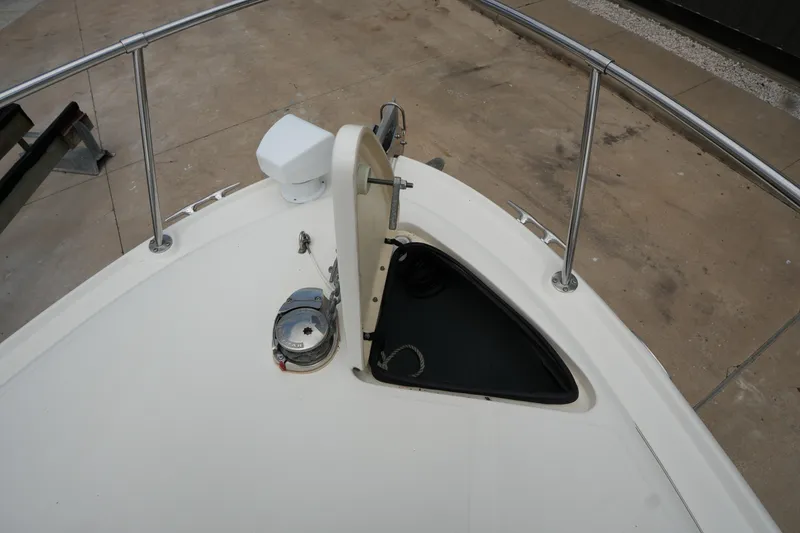 Slide: The Image of Bow of 2000 Sea Ray 270 Sundancer with anchor storage and railing. - 8