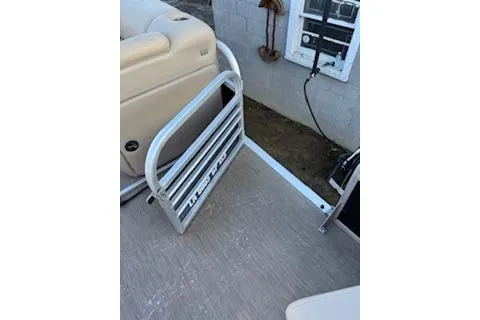 Slide: The Image of 2023 Sun Tracker Fishin' Barge 20 DLX boat deck with foldable ladder. - 12