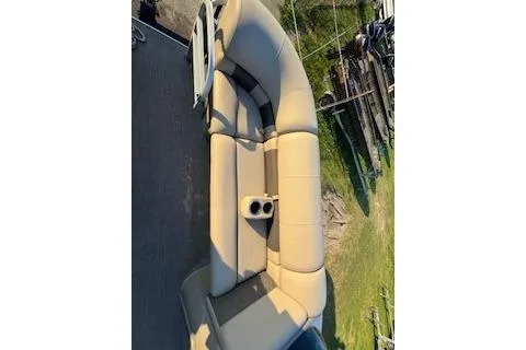 Slide: The Image of 2023 Sun Tracker Fishin' Barge 20 DLX boat seating with cup holders, aerial view. - 8