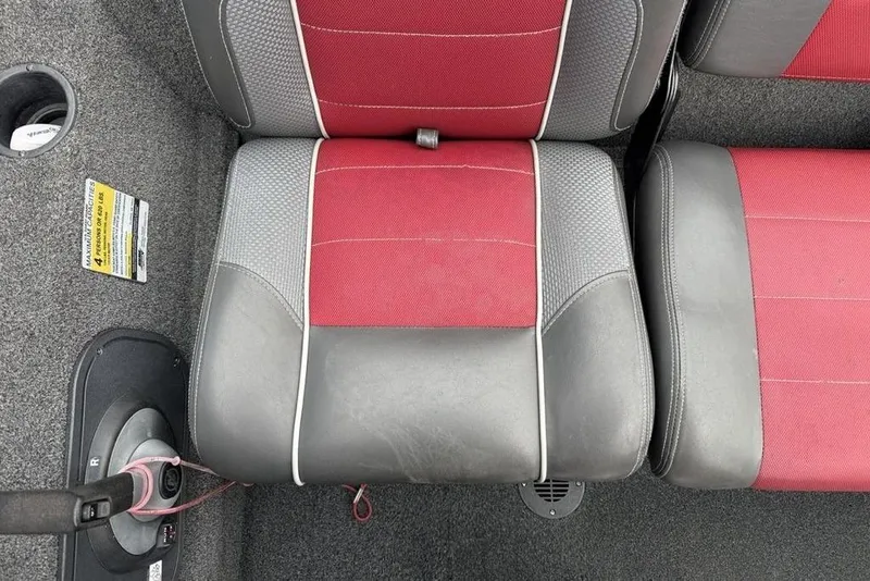 Slide: The Image of 2017 Ranger RT188 boat seat with red and gray upholstery, featuring a cup holder and carpeted floor. - 15