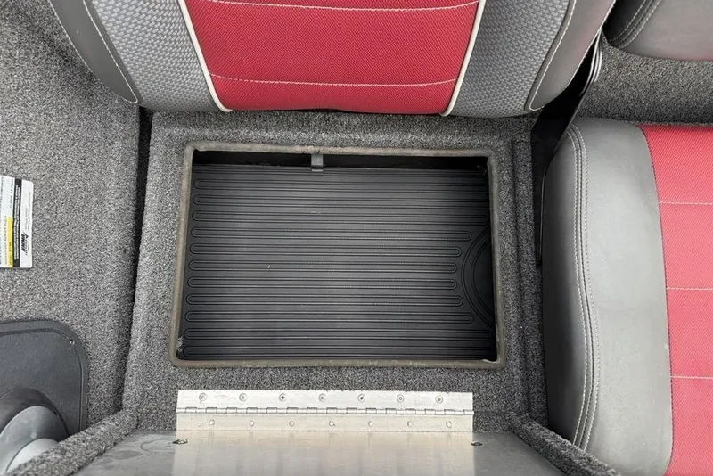 Slide: The Image of 2017 Ranger RT188 boat storage compartment with red and gray seating. - 16