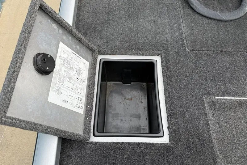 Slide: The Image of 2017 Ranger RT188 boat storage compartment with open lid and wiring diagram. - 19