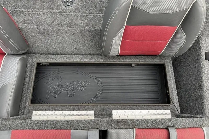 Slide: The Image of 2017 Ranger RT188 boat storage compartment with red and gray seating. - 22