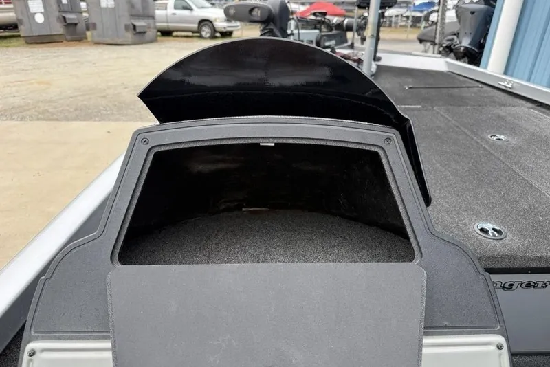 Slide: The Image of 2017 Ranger RT188 boat storage compartment, open lid, outdoor setting. - 24