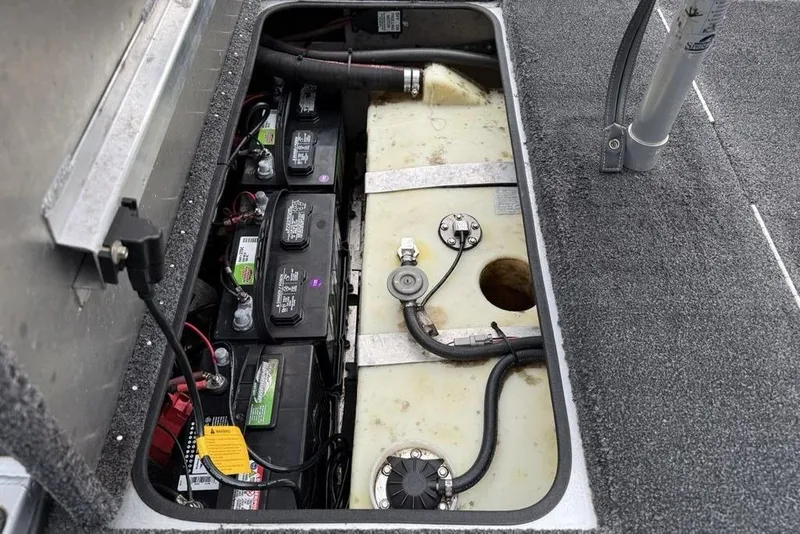 Slide: The Image of 2017 Ranger RT188 boat battery compartment with wiring and fuel tank. - 26