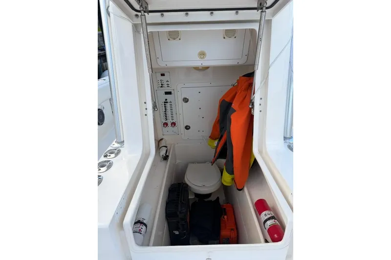Slide: The Image of 2008 SeaVee 320B boat interior with storage, safety gear, and control panel. - 12