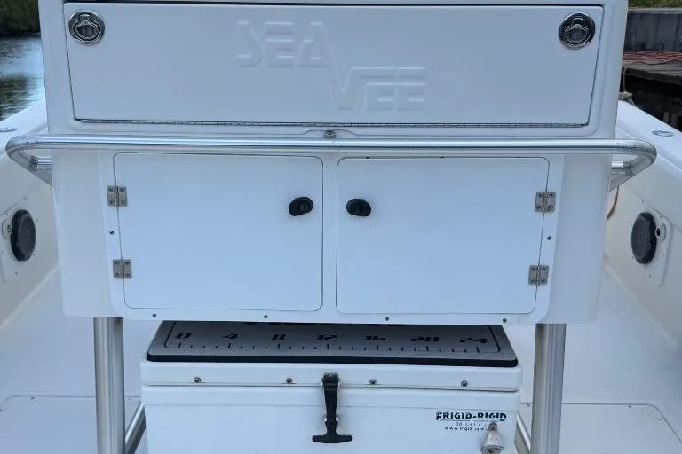 Slide: The Image of 2008 SeaVee 320B boat console with storage compartments and Frigid Rigid cooler. - 19