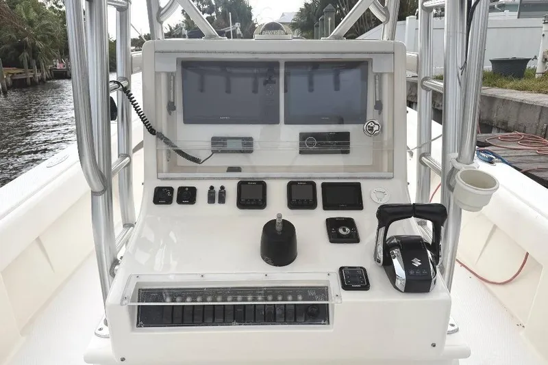 Slide: The Image of 2008 SeaVee 320B boat console with navigation and control systems. - 9