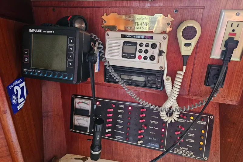 Slide: The Image of Control panel of a 1990 Ericson 34 sailboat with navigation and communication equipment. - 18
